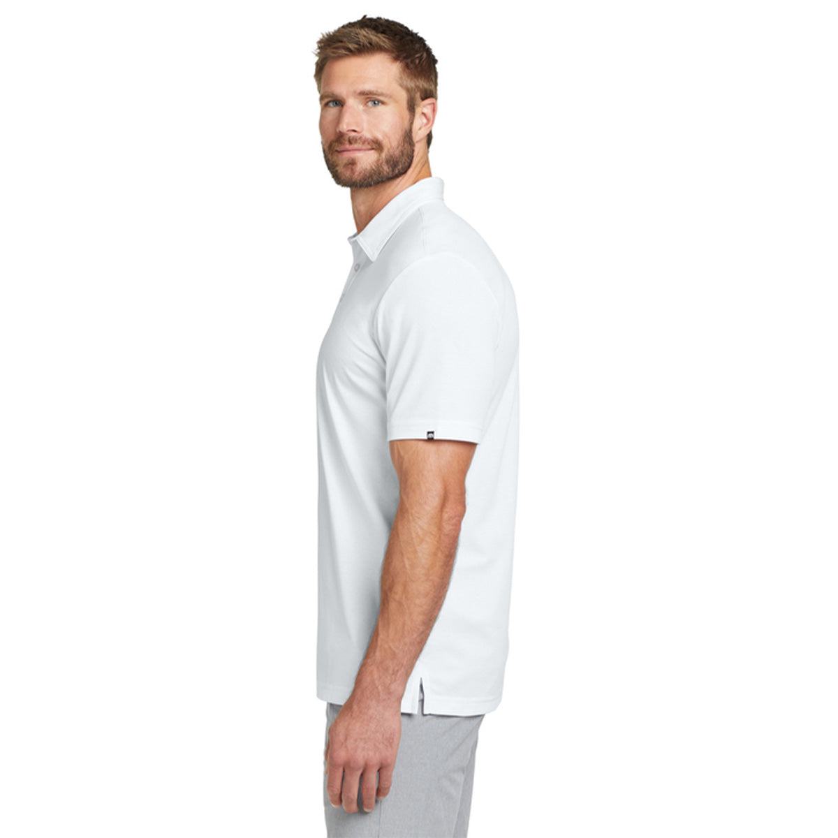 White TravisMathew Oceanside Solid Polo sleeve 